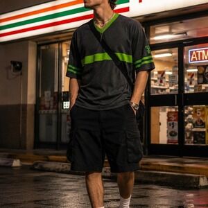 7-Eleven Apparel Jersey Style Graphic Tee Gray Green V-Neck Size M Streetwear